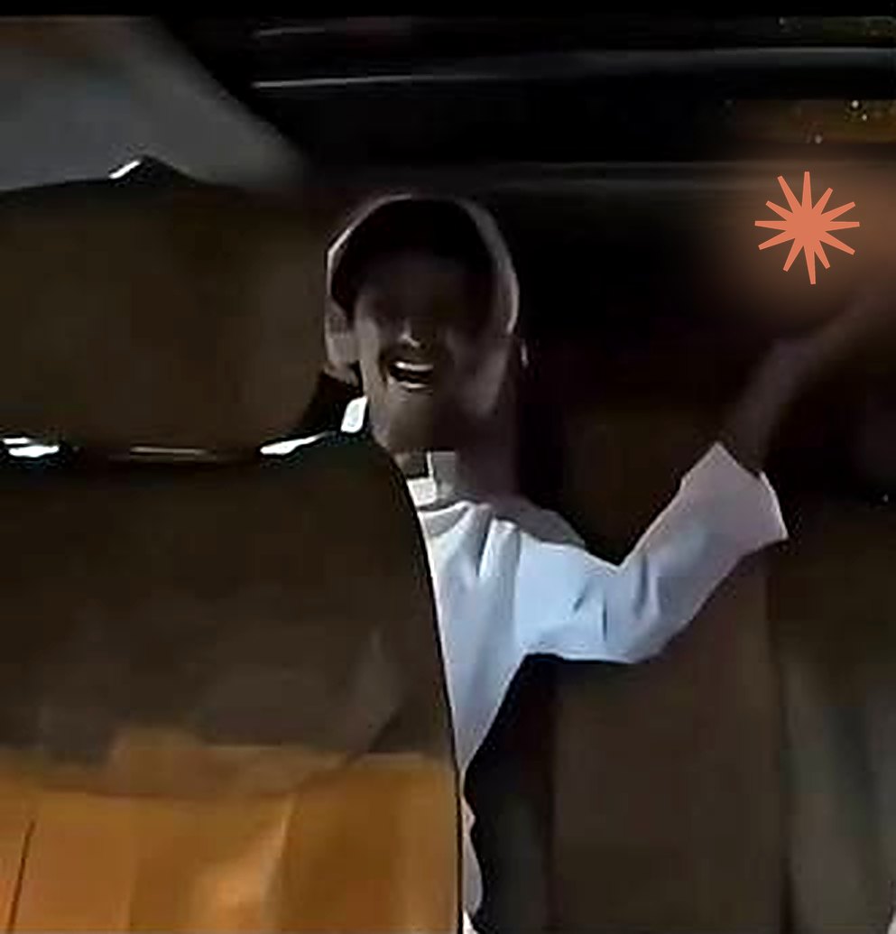 Technologia meme: a smiling man in a car raises his hand with a glowing Claude logo floating above it